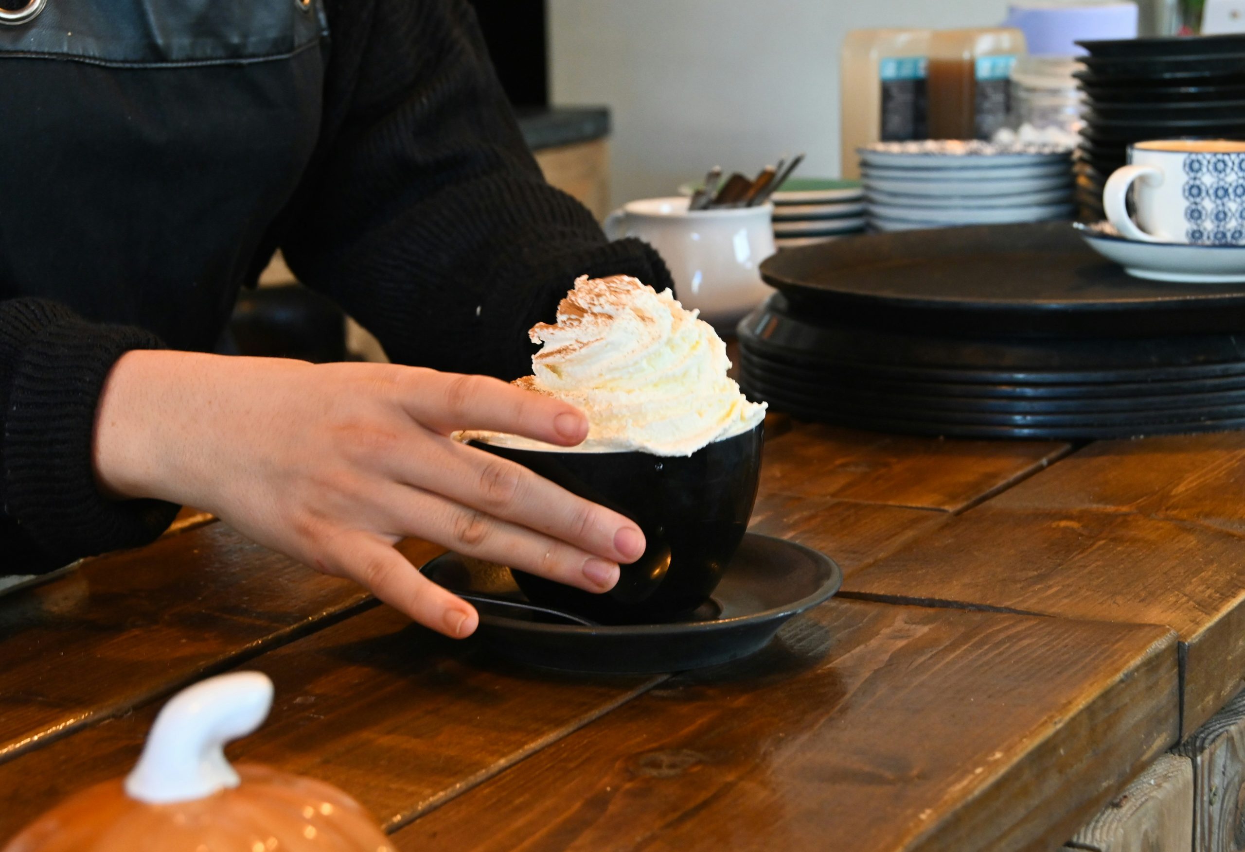 a person holding a cupcake